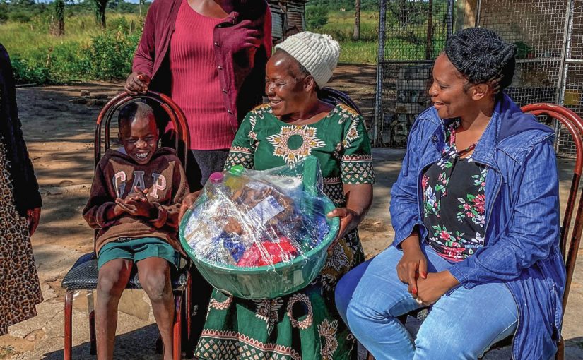 Every Home for Christ partner supports families caring for the disabled - African women and child